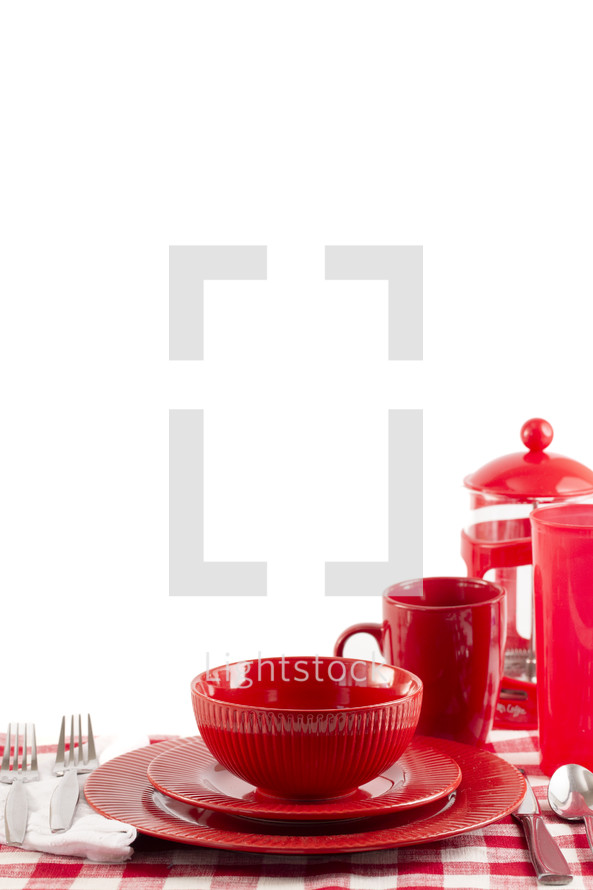 Red dishware on white background
