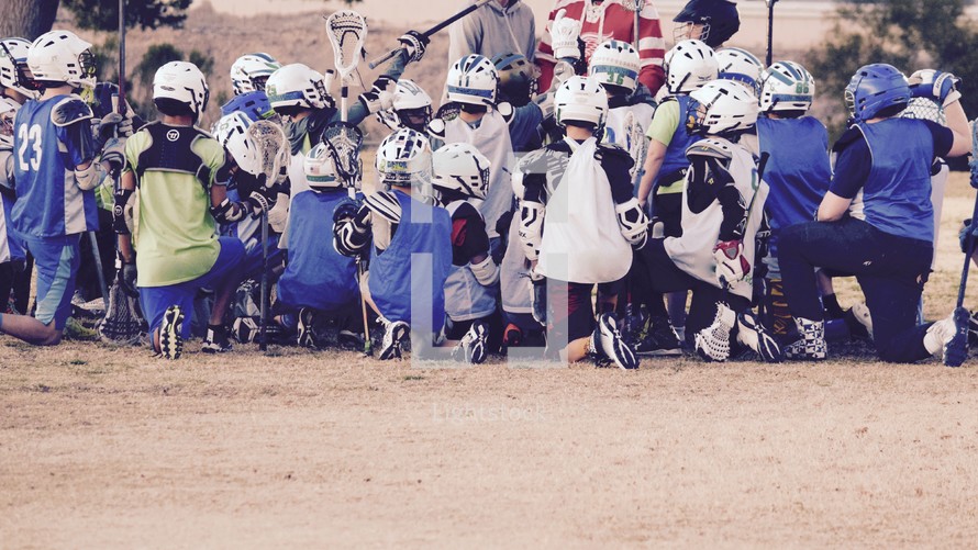 Lacrosse team in a huddle 