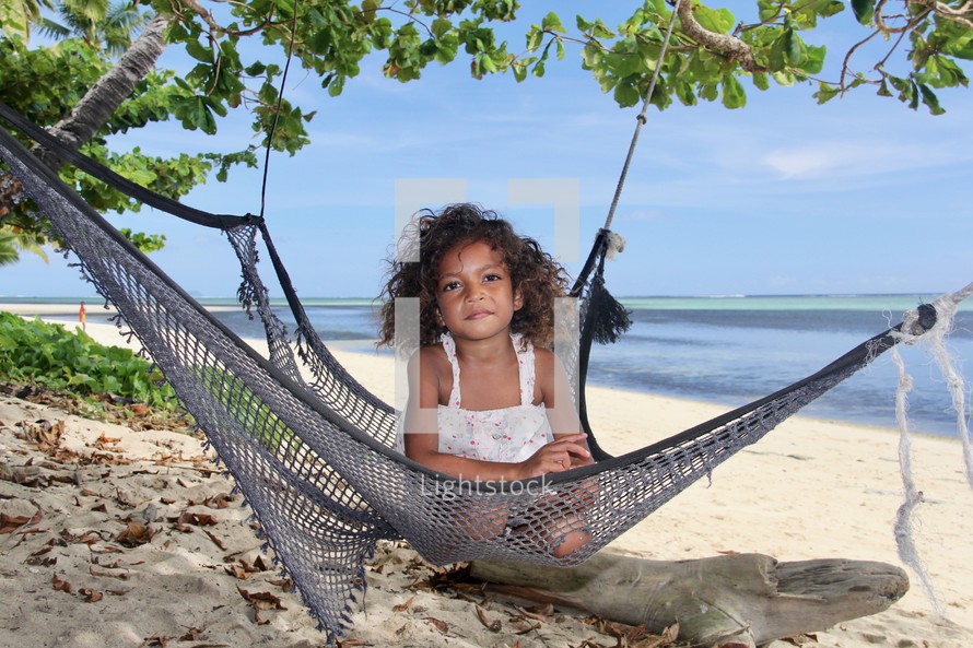 girl in a hammock on a beach 
