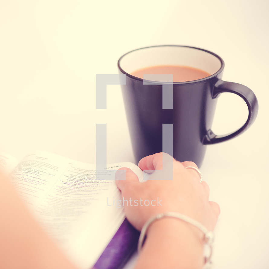woman reading a Bible and coffee 