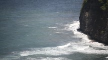 waves crashing into cliffs 