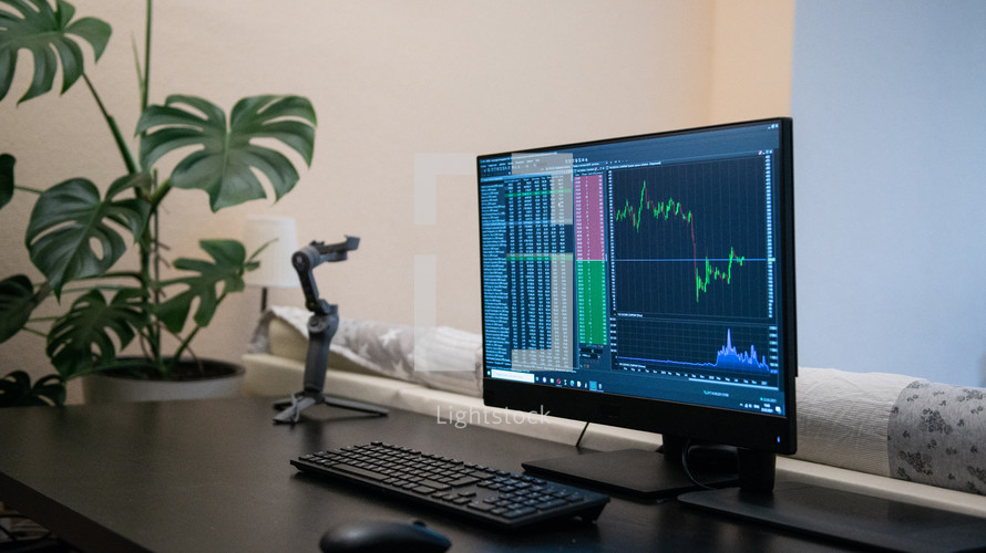 Computer screen with stock market changes, scrolling and analysing numbers at home work