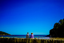 couple looking out at a bay 