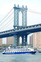 ferry boat under a bridge in NYC 