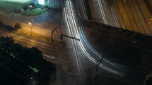 streaks of light from cars on a road at night 