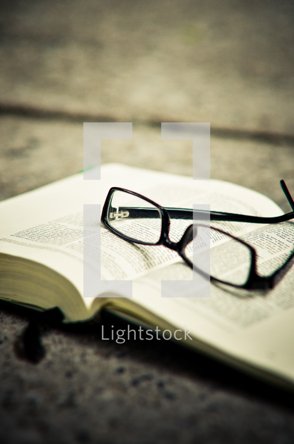 Glasses on Bible