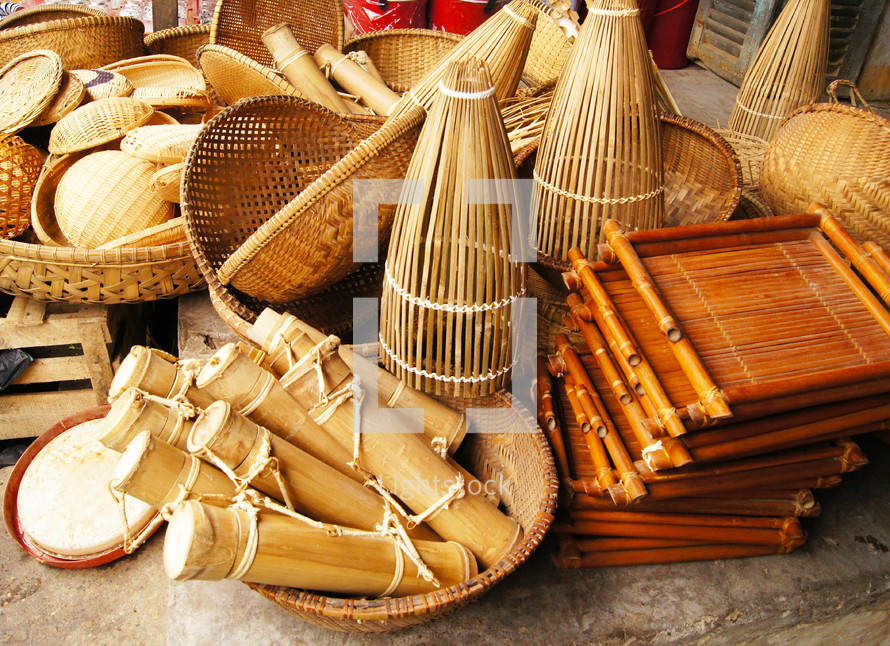 Different types of bamboo, wooden and thatched baskets and containers
