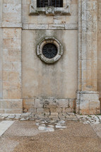 circular window on a stone building 