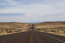 long road ahead through a desert 