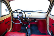 Florence, Italy - January 12, 2012: Vintage Fiat 500 was one of the most produced European. Interior view with customizable windshield and side windows.