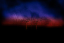 Good Friday crosses against a dark sky 