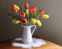 tulips in a pitcher vase 