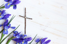 cross made of sticks and purple irises 