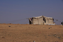 A migrant, refugee or nomadic herdsman tent in the desert