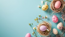 Colorful Easter eggs in nests with spring flowers on a blue background