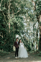 portrait of a bride and a groom in jungles 