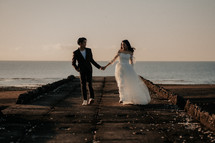 portrait of a bride and groom on a beach 