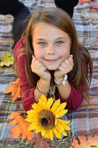 portrait of a young girl with a sunflower 