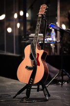 acoustic guitar on a stage 