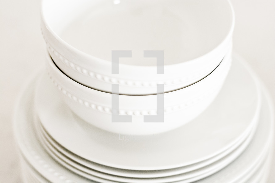 white bowls and plates 