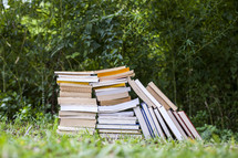 stack of books on the ground 