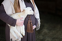 pregnant Mary holding a lamb