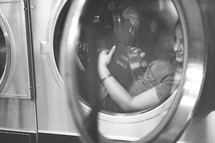 a woman at a laundry mat 