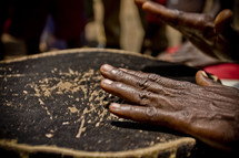 Black hands playing on a drum - music
