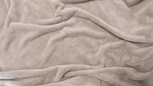 rumpled fleece blanket background 