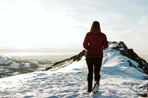 Woman hiking on a snowy mountain