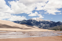sand dunes, mountains, and shore 