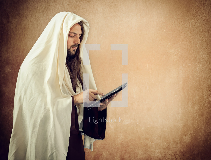 Jesus using a tablet 