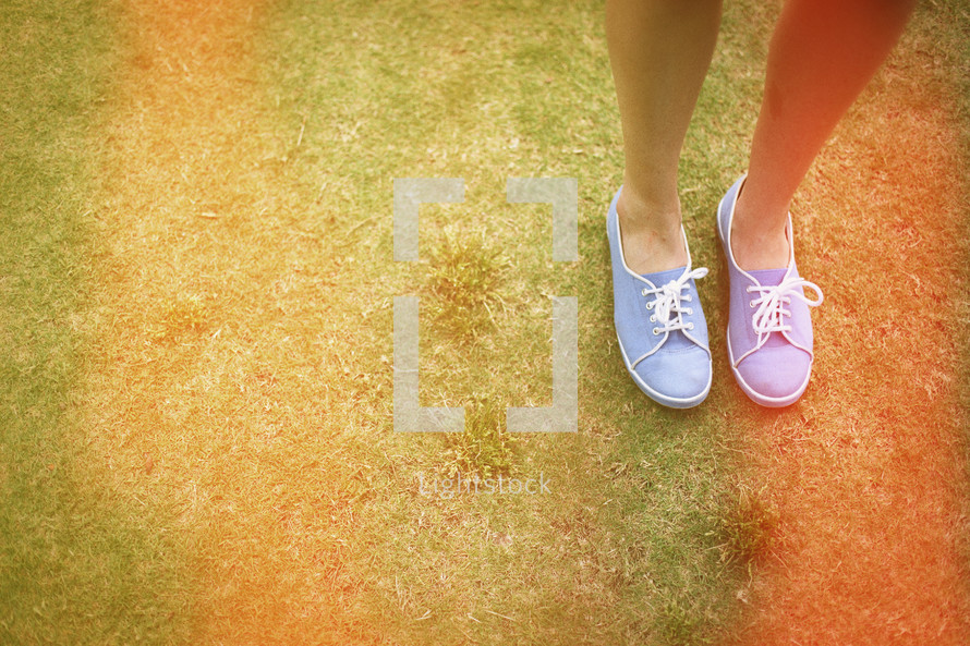 woman's feet on grass