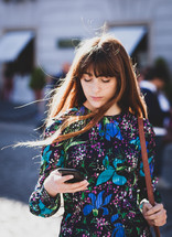 Young woman looking at mobile phone.