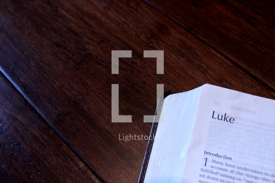 a Bible opened to Luke 