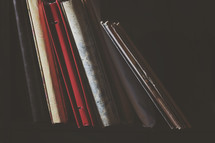 a shelf of albums and books