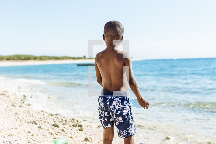 a boy child on a beach 