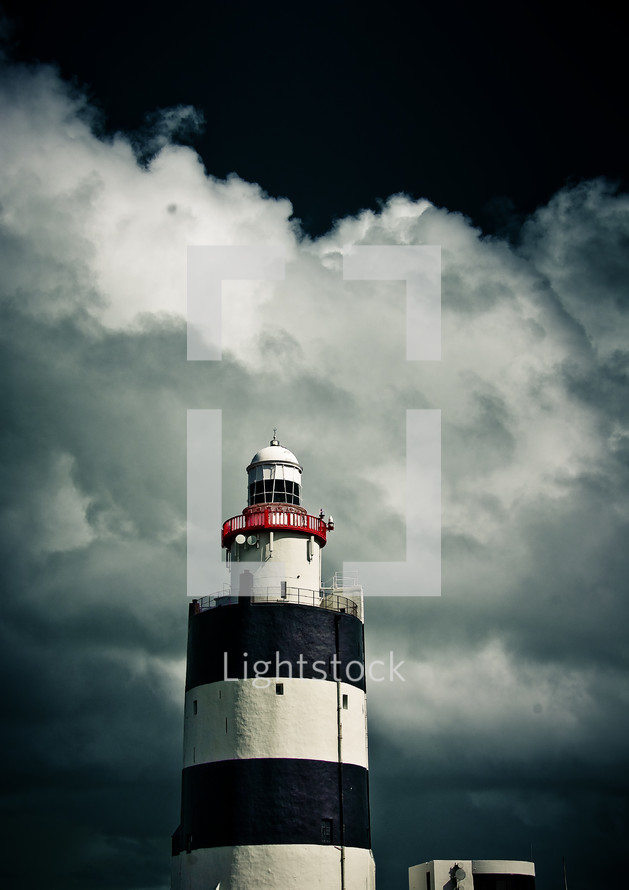 black and white lighthouse and storm clouds 