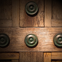 Old wooden doors with metal medallions.