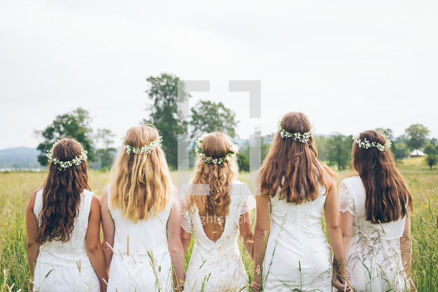 bridesmaids with flowers in their hair 
