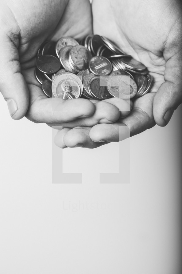 cupped hands holding coins