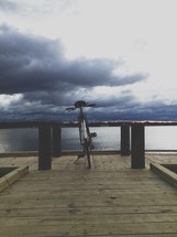 bike parked on a pier 