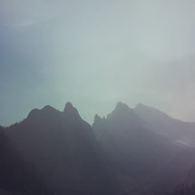 an iphone capture of the hazy mountain peaks, extra texture added
