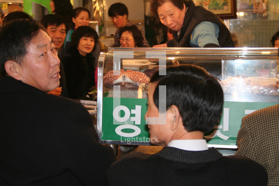 people eating in Korean restaurant 