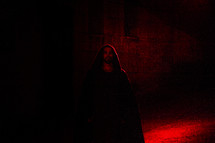 A red light shining on an actor portraying Jesus in the Passion Play.