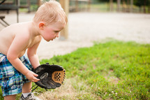 toddler boy with a baseball mitt 
