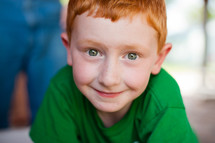 little boy with red head and green eyes 