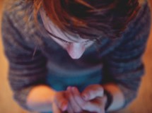 A young man in prayer 