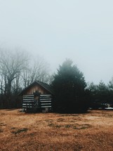 a cabin in fog 
