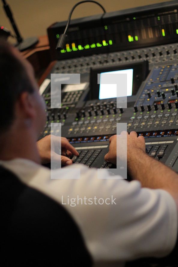 Man operating a production board.